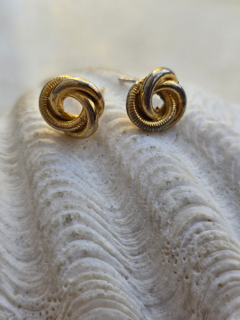 Gold tone knot stud earrings